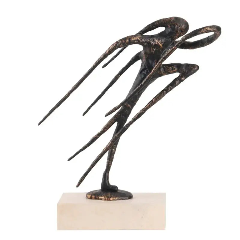 Abstract bronze and gold geometric abstract face sculpture with dynamic elongated form for living room display