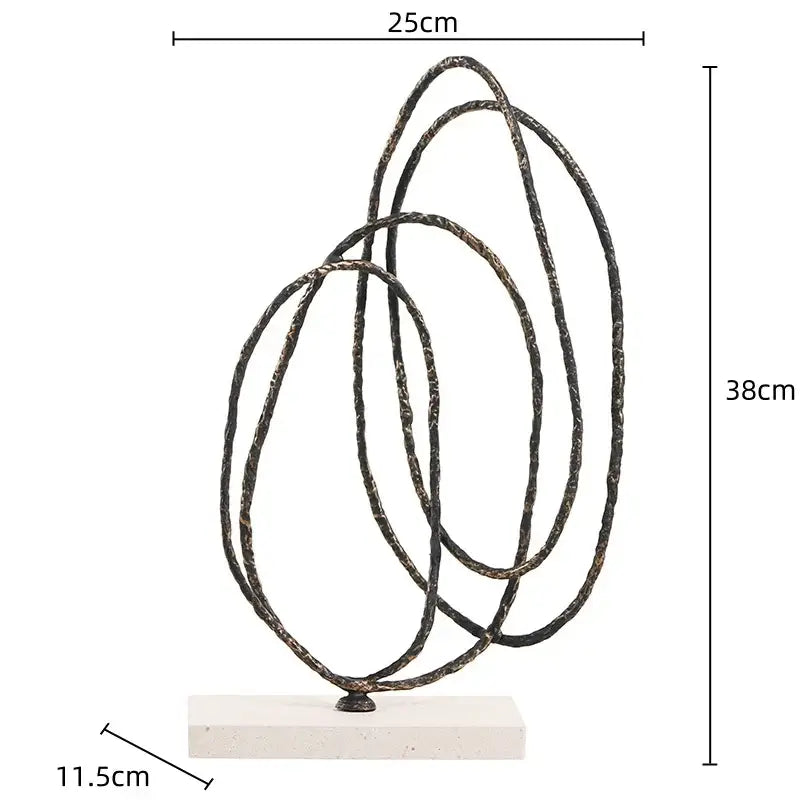 Abstract bronze and gold geometric abstract face sculpture with intertwined textured rings on white base for living room