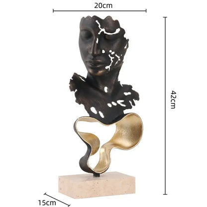Abstract bronze and gold geometric abstract face sculpture with textured fragmented design on beige marble base