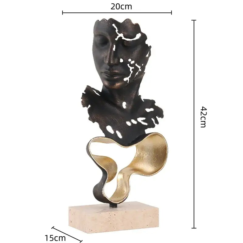 Abstract bronze and gold geometric abstract face sculpture with textured fragmented design on beige marble base
