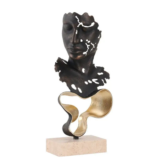 Abstract bronze and gold geometric abstract face sculpture with cut-out details on a stone base for living room display
