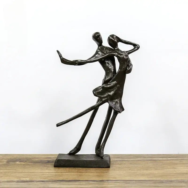 Black metal decorbites couple dancers portrait sculpture of two abstractly stylized dancers in an embrace on base