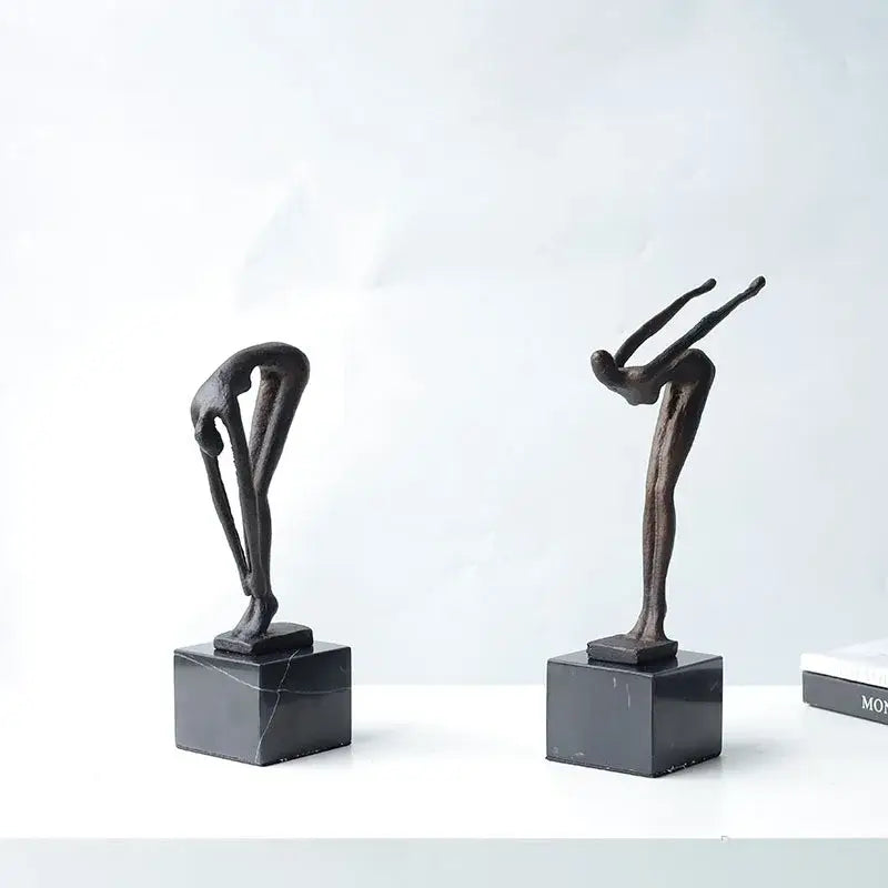 Two abstract bronze diving sportsman metal sculptures on black marble bases for living room decor