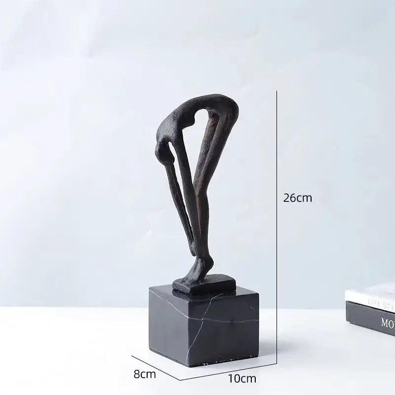 Black abstract bronze diving sportsman metal sculpture in arched pose on square black marble base for living room decor