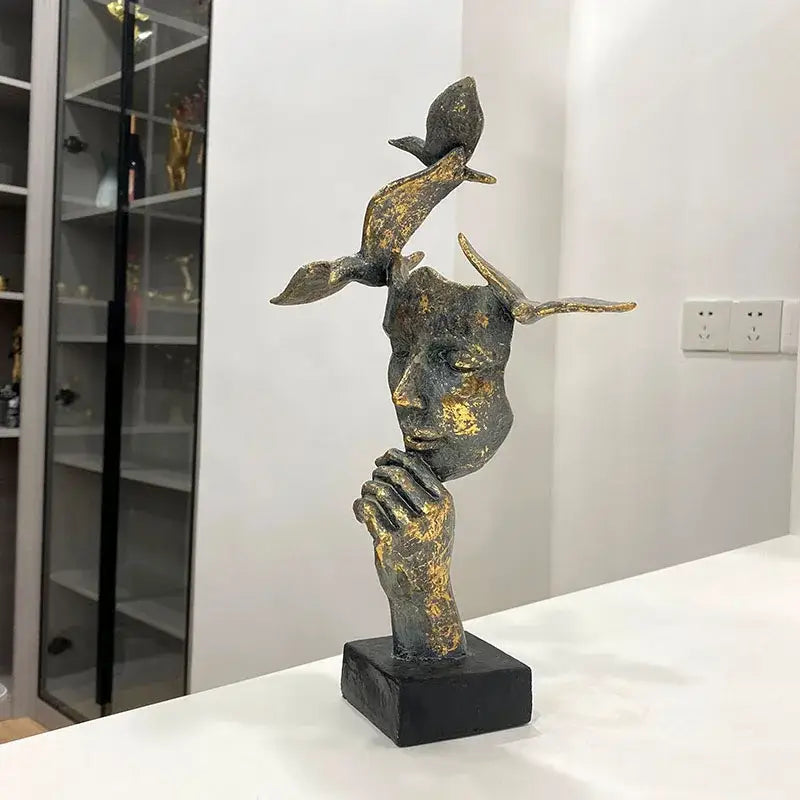 Bronze and gold-toned abstract golden mask bird figurine statue with birds on head on black base for office decor