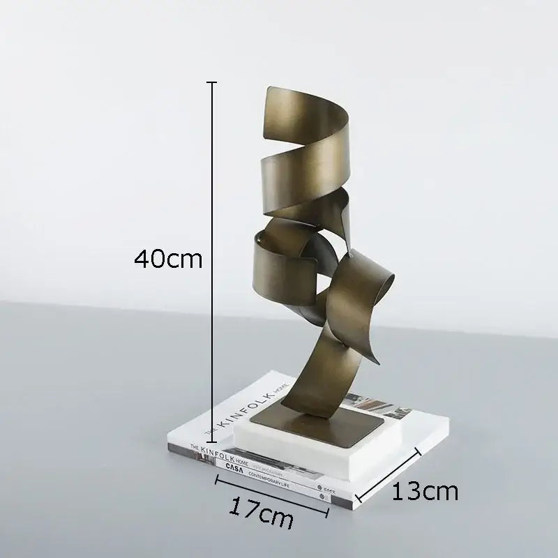Abstract bronze irregular crimp metal sculpture with spiral ribbon design on white base for living room decor