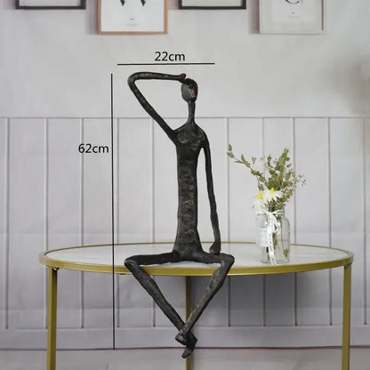 Black abstract metal human sculpture with elongated limbs and textured finish for living room decorbites abstract metal decor
