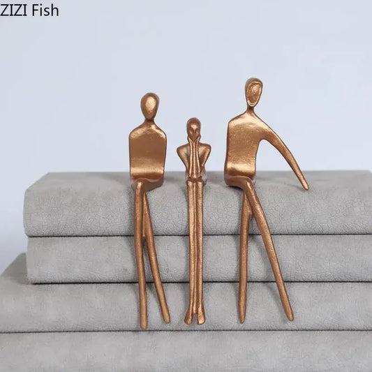 Bronze-colored abstract sculpture set of three stylized gold plated figures ideal for living room decorbites decor