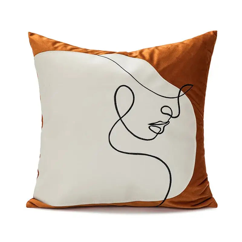 A square pillow cover with burnt orange velvet framing and minimalist black line art on an off-white panel for decorbites abstract plush decor