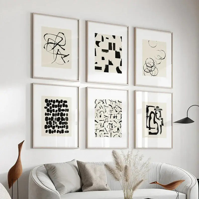 Six framed decorbites™ beige abstract canvas poster prints featuring black ink on off-white paper with silver frames