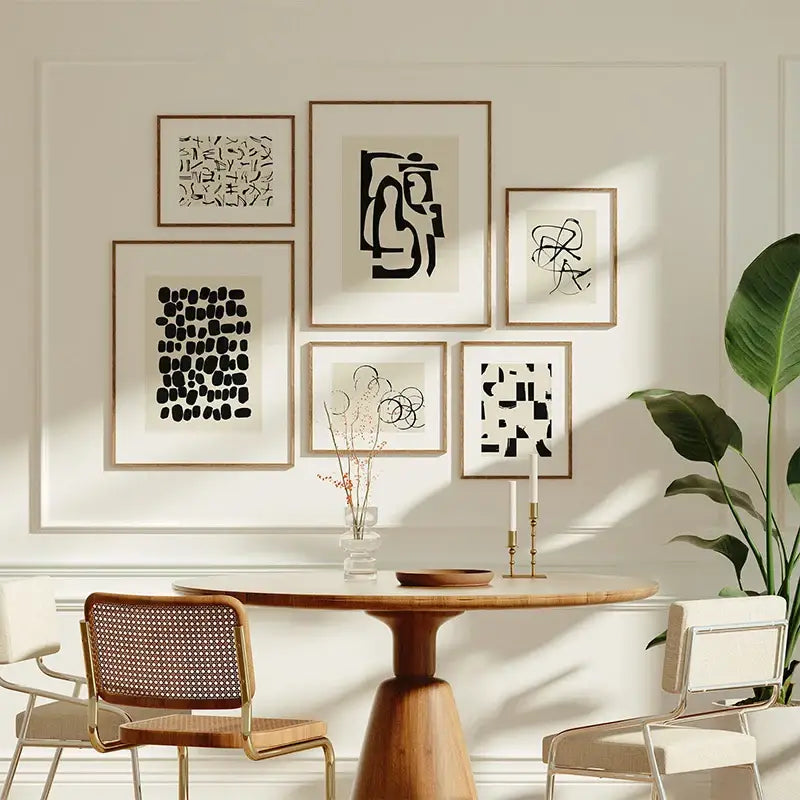 A set of six decorbites™ beige abstract canvas poster prints in thin light wood frames on a white wall