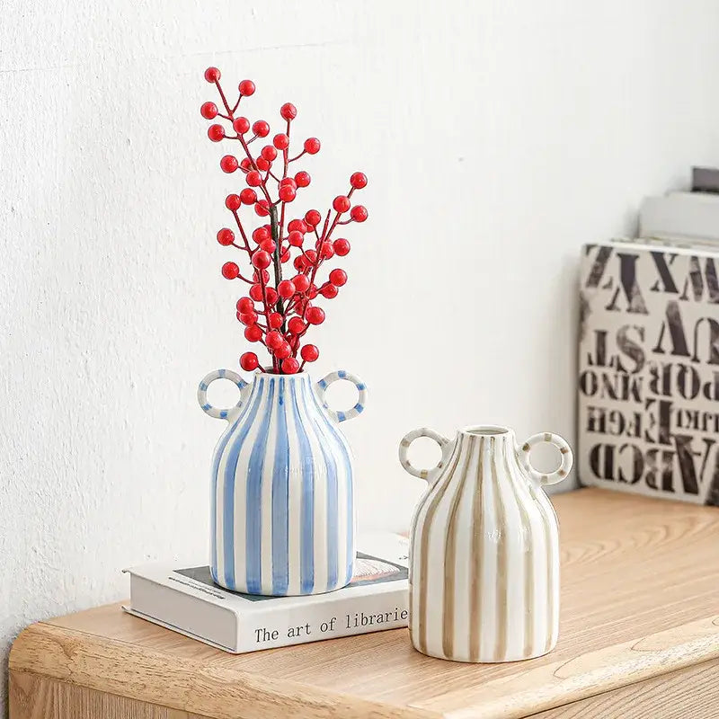 Abstract ceramic hydroponic blue and white striped ceramic hydroponic vase with double ear handles holding red berries