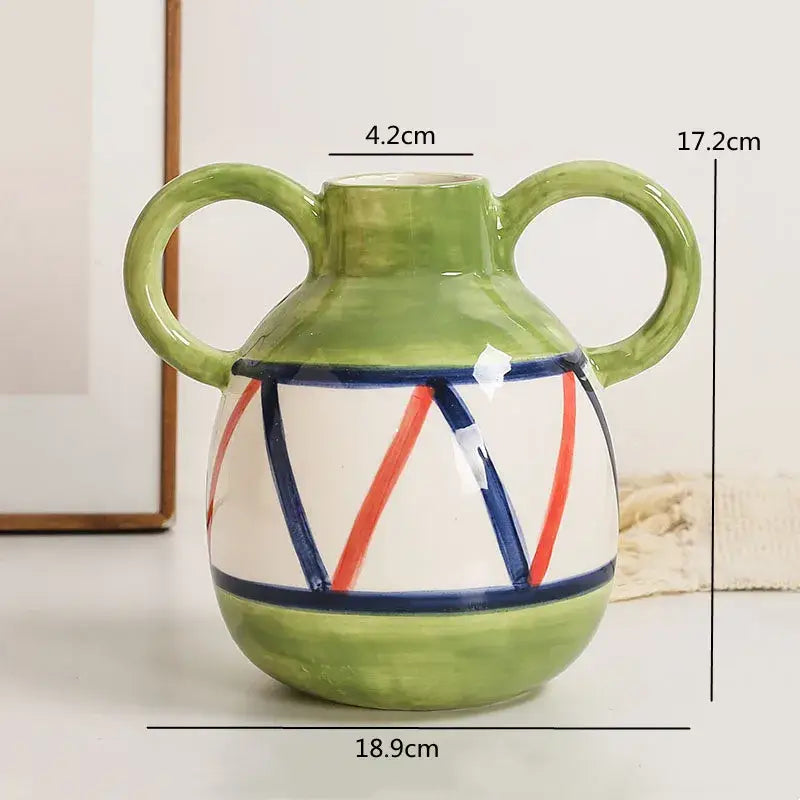 Abstract ceramic hydroponic vase with double ear green handles white body red and blue stripes and solid green base