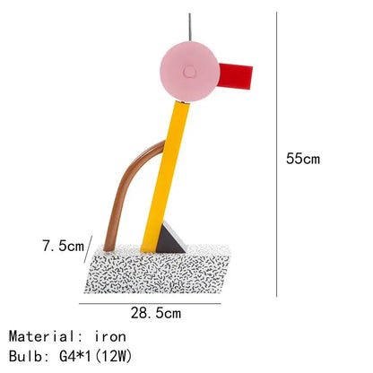 A modern abstract duck led table lamp with pink circular head red accent yellow brown curved arms on speckled base