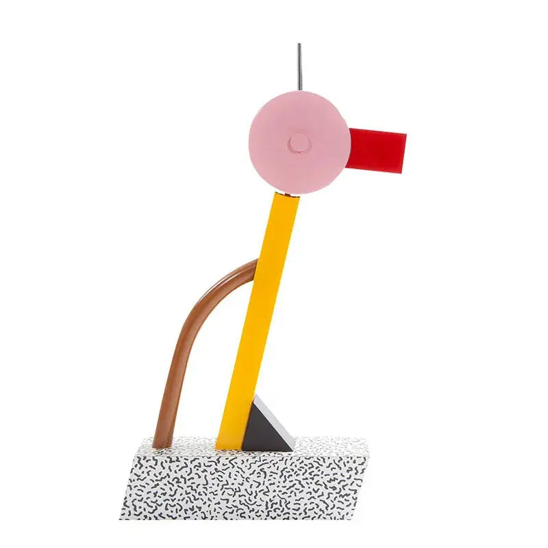 Abstract duck led table lamp with vibrant pink, red, yellow, brown, and black sculpture on speckled white base