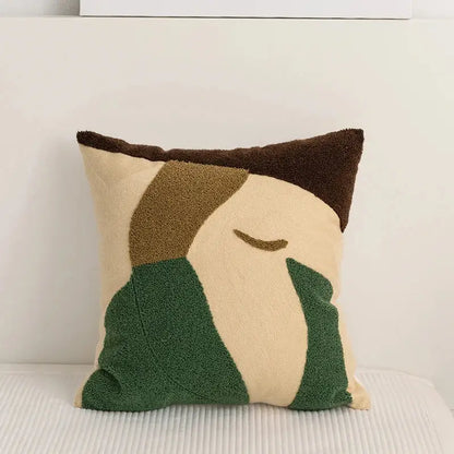 Beige and green embroidery pillow cover with abstract pattern and brown trim for living room decor