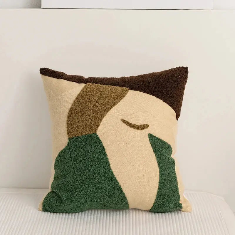 Beige and green embroidery pillow cover with abstract pattern and brown trim for living room decor