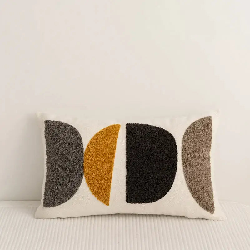 Rectangular embroidery pillow cover with abstract pattern in gray mustard yellow black and taupe on cream background