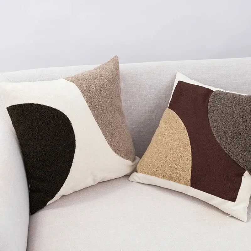 Two modern cushion covers with abstract handmade knot patterns in earthy tones of black beige and brown for living room decorbites decor