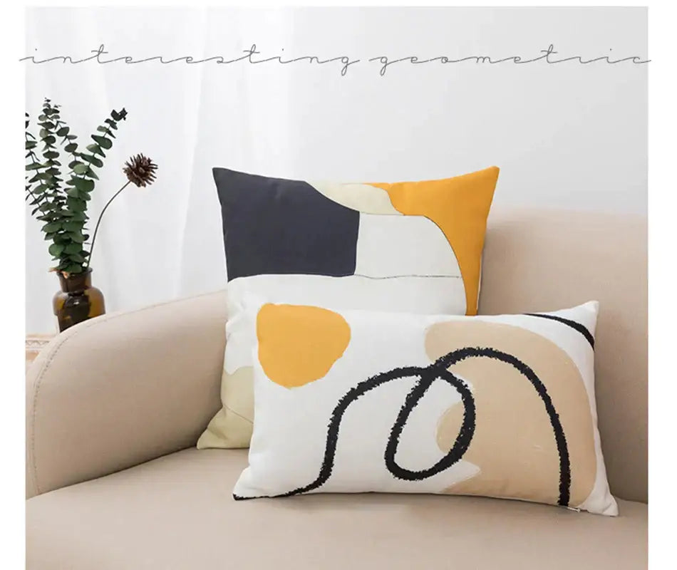 Abstract geometric print white pillow cover with bold mustard yellow cream shapes and textured black line decorbites design