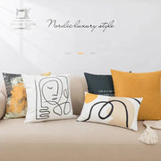 White throw pillow cover with black abstract geometric print and stylized face for living room decorbites decor