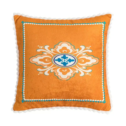 Orange velvet cushion cover with central white and teal floral medallion embroidery for decorbites abstract geometric decor