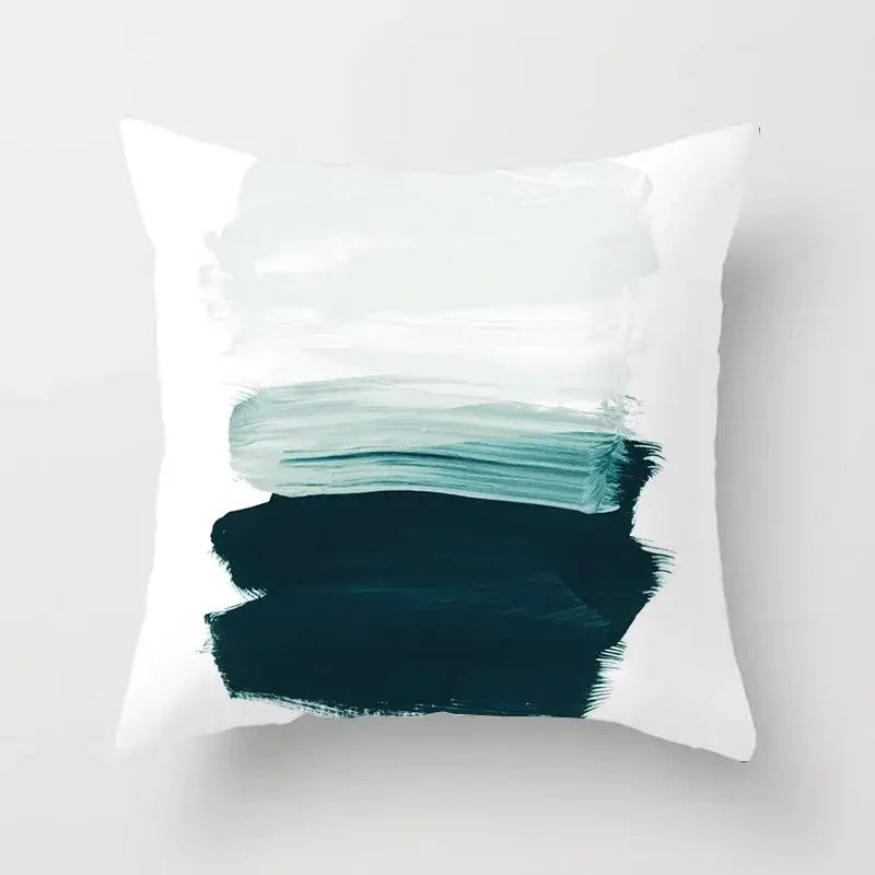 White throw pillow cover with abstract teal and dark green brushstroke design featuring decorbites geometric stitch print decor