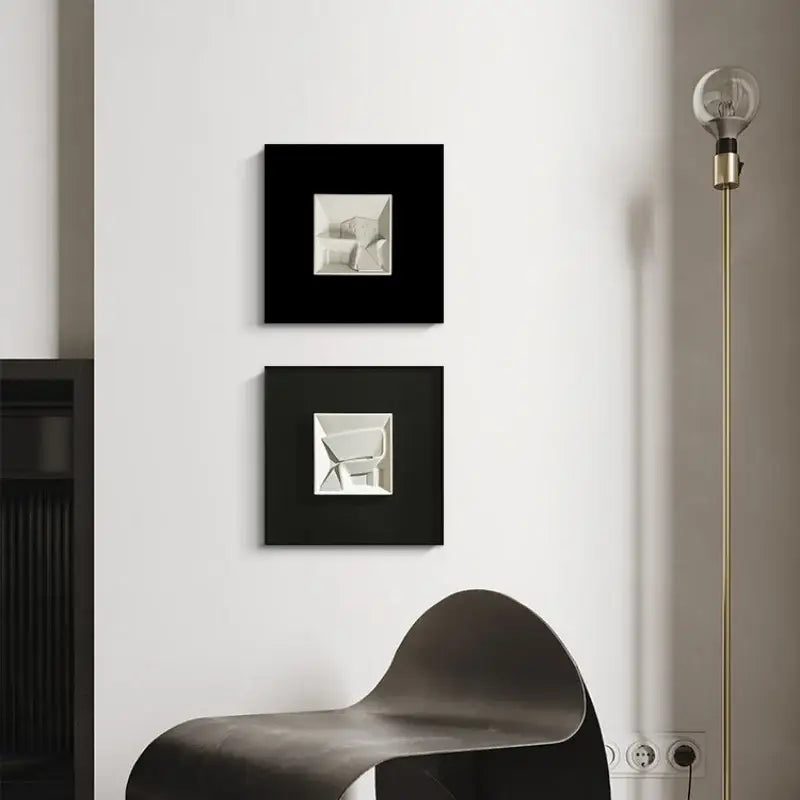 Two black-framed decorbites abstract geometric wall decorations with silver designs for orange and white living room decor