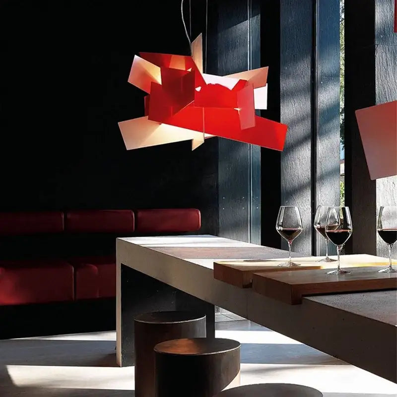 A vibrant red geometric pendant lamp with angular facets enhances modern decorbites big bang led living room decor