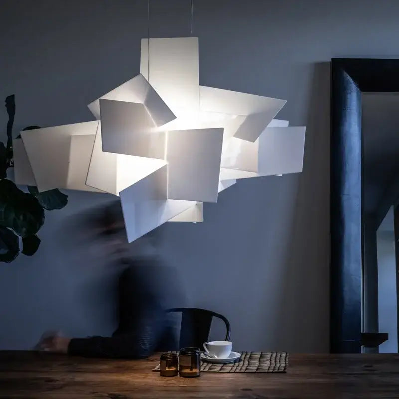 A modern white geometric pendant lamp with layered angular design suitable for decorbites big bang led decor