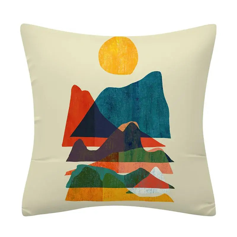 Cream-colored cushion cover with decorbites geometry pattern featuring abstract mountain landscape and textured sun