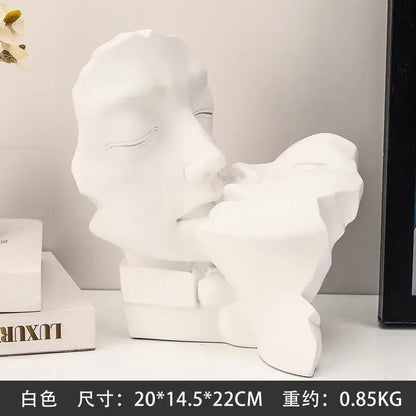 White resin abstract gold head couple sculpture featuring two faces in a tender embrace for living room decorbites decor