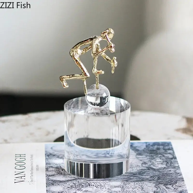 Gold-toned abstract figures desk sculpture holding object on decorbites crystal base with silver band for living room decor