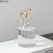Gold-colored abstract figures desk decor featuring intertwined design on clear acrylic base by decorbites crystal sculpture