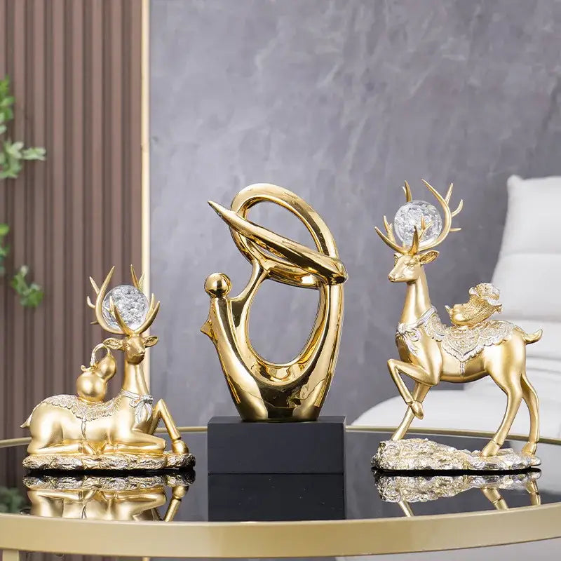 Decorative figurine of golden geometric human with crystal antlers and ornate detailing on reflective surface for living room decor