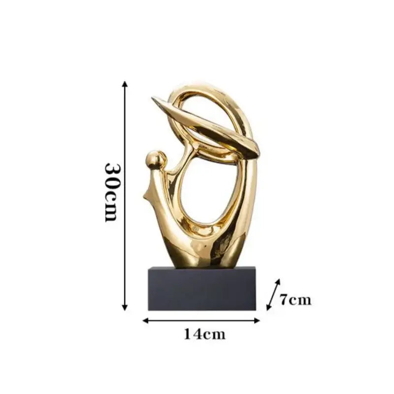 Golden geometric human decorative figurine with flowing abstract forms mounted on a black base for living room decorbites decor