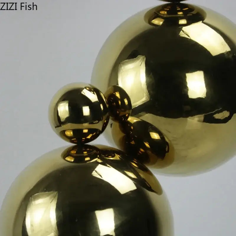 Abstract golden balls geometric metal sculpture with shiny gold metallic spheres for living room decorbites golden balls decor