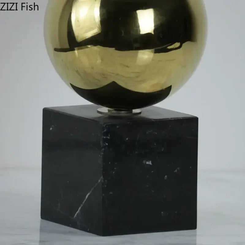 Shiny gold metallic sphere golden balls geometric metal sculpture on black marble base for living room decorbites decorbites golden balls