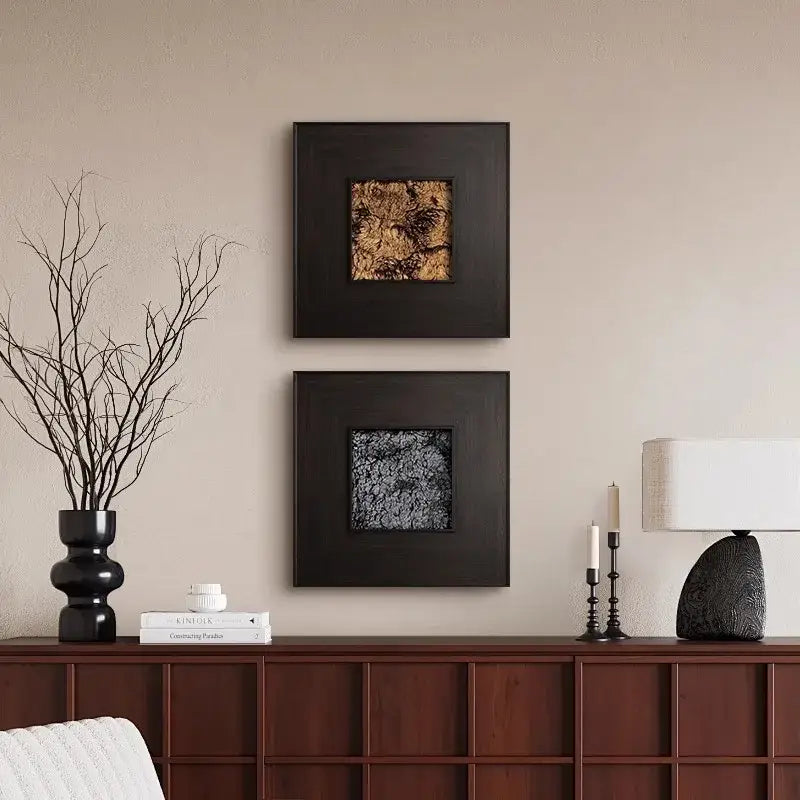 Two decorbites fur decorative square paintings with textured golden brown fur centers in dark matte frames for living room decor
