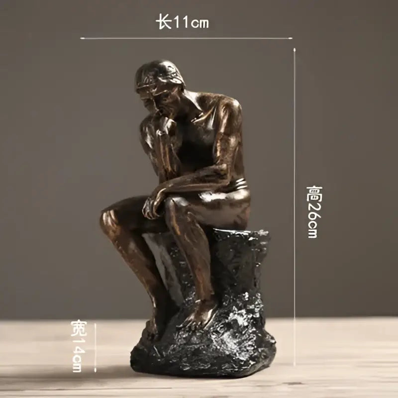 Bronze-colored thinker resin statue with detailed musculature on rocky base for living room decor gold resin statue