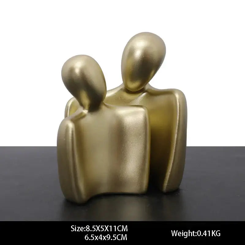 Gold resin statue abstract sculpture of two stylized human figures embracing for living room decor resin statue