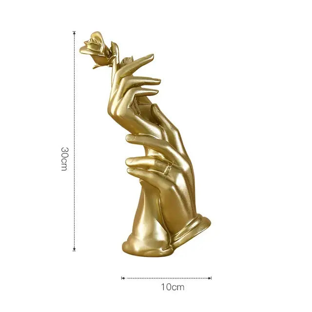 Gold resin statue of two hands delicately cradling a rose for elegant living room decor in gold resin material