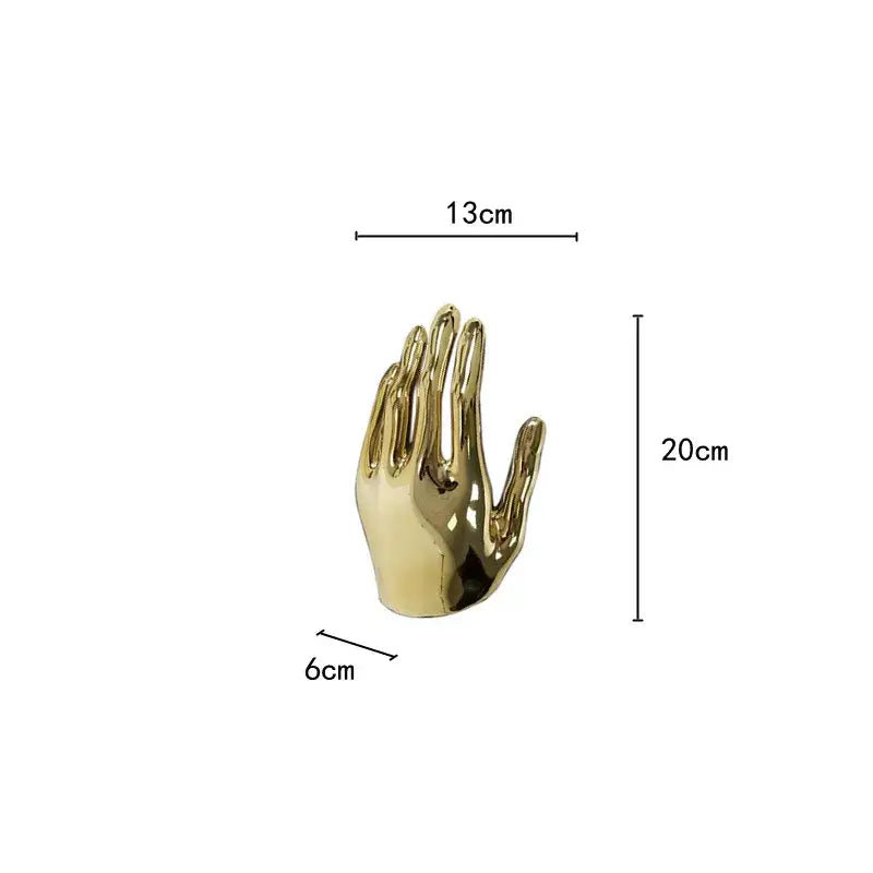 A polished gold-colored metallic hand-shaped decorbites abstract golden hands resin sculpture for living room decor