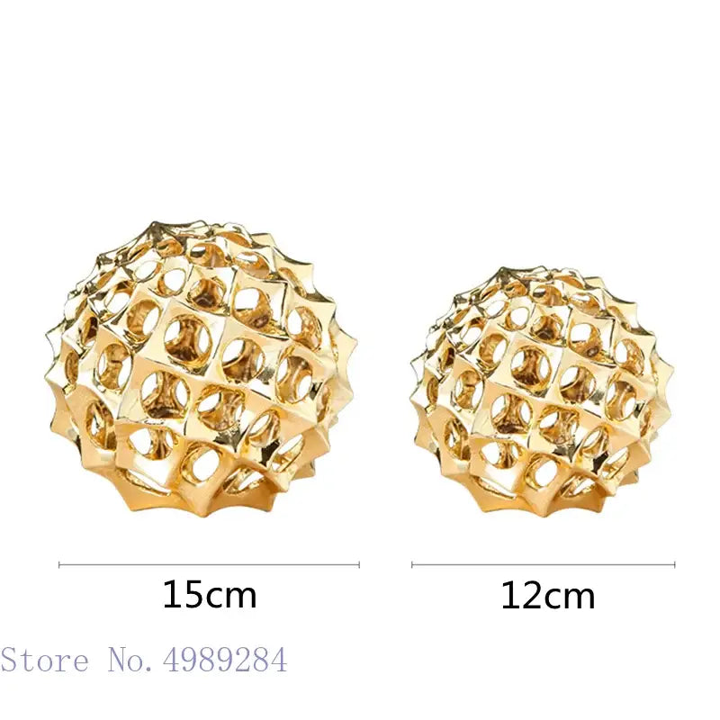 Abstract golden metal hollow ball spike ornaments with geometric patterns and metallic finish for living room decor