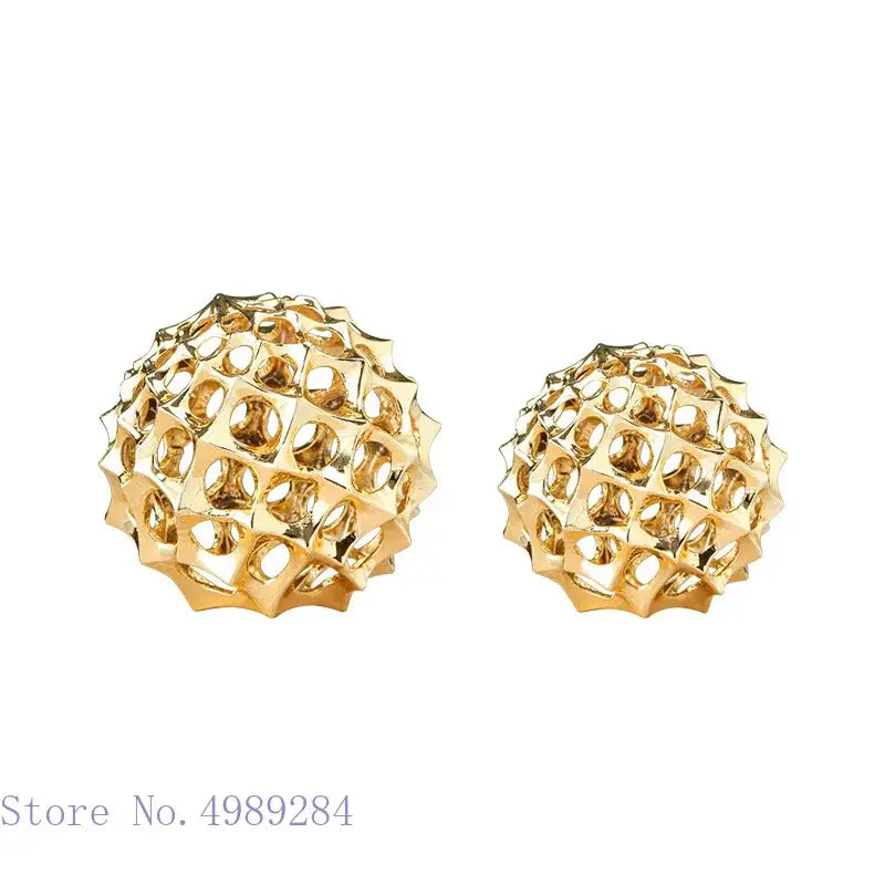 Abstract golden metal hollow ball spike earrings with geometric lattice design for stylish living room decor