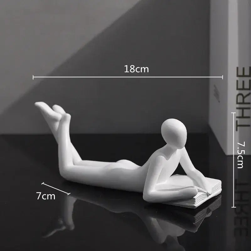 White ceramic minimalist golden thinker reader figurine reclining and reading for living room decor