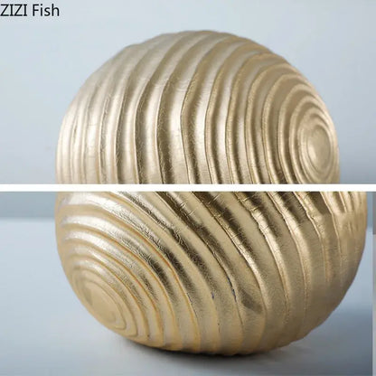 Abstract golden wave ball sculpture with concentric ridged patterns in ribbed metal decor for living room display