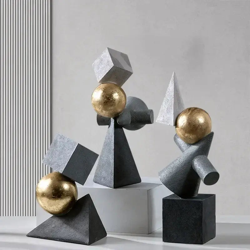 Abstract gray and gold ball sculpture featuring geometric gold ball design with matte gray and metallic gold decorbites accents