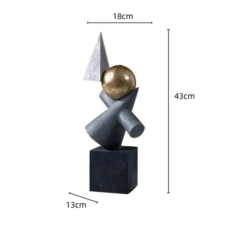 Abstract gray and gold ball sculpture decor featuring a geometric gold ball atop intersecting gray forms on a matte base