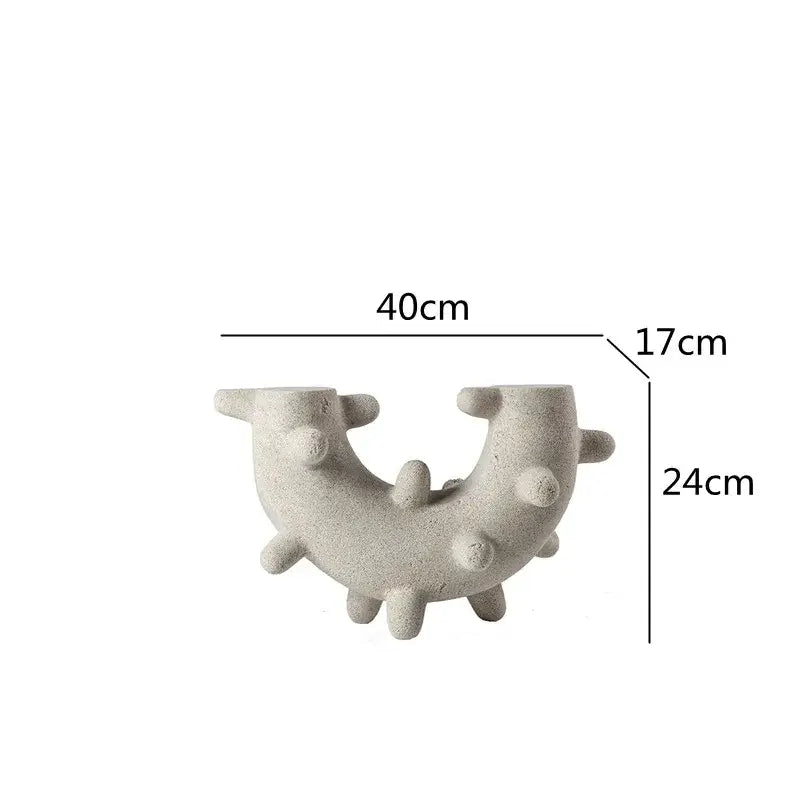 Gray concrete u-shaped candle holder with textured surface and rounded protrusions geometric cactus resin decor